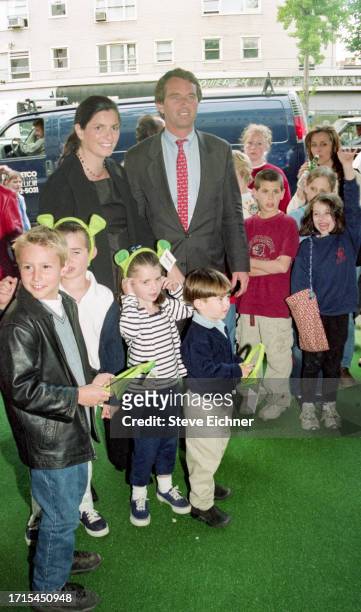 View of married American couple, architect Mary Richardson Kennedy and attorney Robert F Kennedy Jr, along with several children, at a screening of...