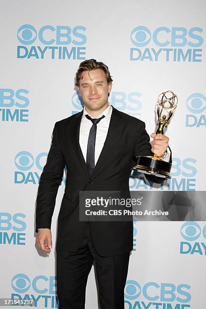 Billy Miller of The Young and the Restless celebrates his win for Outstanding Supporting Actor at the 2013 CBS Daytime Emmy After-Party at theTHE...