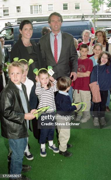 View of married American couple, architect Mary Richardson Kennedy and attorney Robert F Kennedy Jr , along with several children and a costumed...