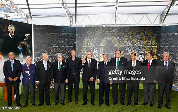 Carlo Ancelotti with the executive team of Real Madrid during his presentation as coach of Real Madrid at Estadio Santiago Bernabeu on June 26, 2013...