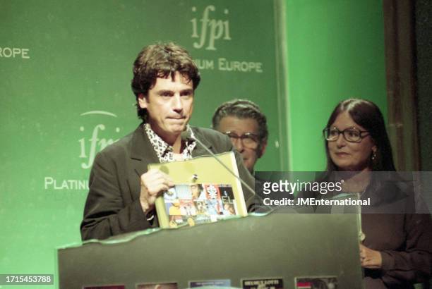 Jean-Michel Jarre, David Fine and Nana Mouskouri during The Platinum Europe Awards 1998, Albert Hall, Brussels, Belgium, on 9 July 1998.