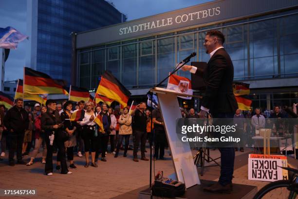 Former member of Germany's military speaks to supporters of the far-right "Zukunft Heimat" movement on German Unity Day on October 03, 2023 in...