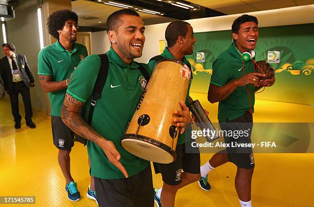 Dante, Daniel Alves, Lucas Moura and Paulinho of Brazil arrive at the stadium playing musical instrumenets prior to the FIFA Confederations Cup...