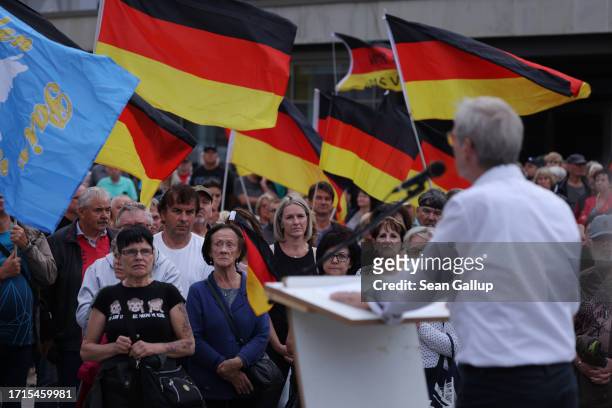 Christoph Berndt, leader of the far-right "Zukunft Heimat" movement, speaks to supporters on German Unity Day on October 03, 2023 in Cottbus,...