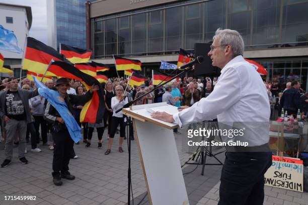 Christoph Berndt, leader of the far-right "Zukunft Heimat" movement, speaks to supporters on German Unity Day on October 03, 2023 in Cottbus,...