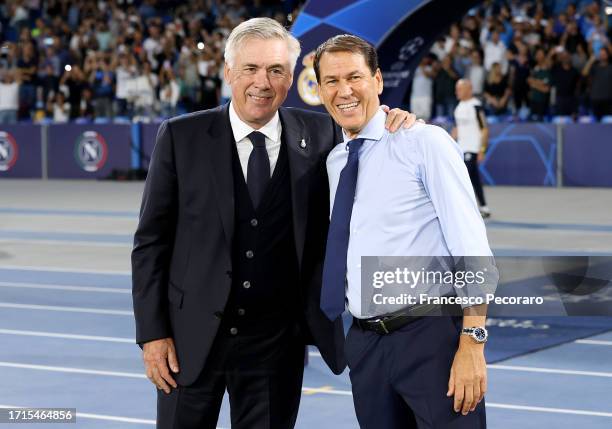 Carlo Ancelotti, Head Coach of Real Madrid, poses for a photo with Rudi Garcia, Head Coach of Napoli, prior to the UEFA Champions League match...