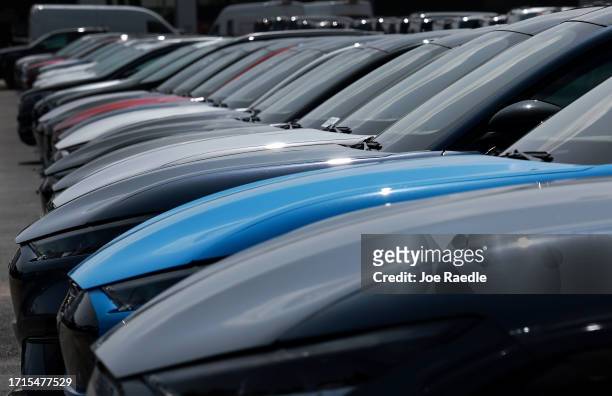 New vehicles sit on a Ford dealership's lot on October 03, 2023 in Miami, Florida. U.S. Automakers show a rise in sales in the third quarter even...