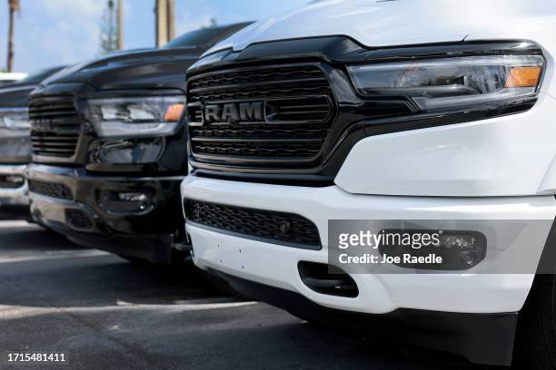 New Ram vehicles sit on a Dodge Chrysler-Jeep Ram dealership's lot on October 03, 2023 in Miami, Florida. U.S. Automakers show a rise in sales in the...