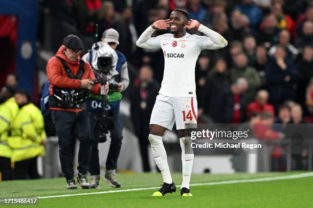 Wilfried Zaha of Galatasaray S.k celebrates after scoring the team's first goal during the UEFA Champions League match between Manchester United and...