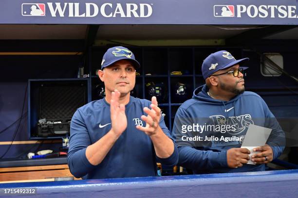 Manager Kevin Cash of the Tampa Bay Rays looks on from the dugout prior to the start of Game One of the Wild Card Series against the Texas Rangers at...
