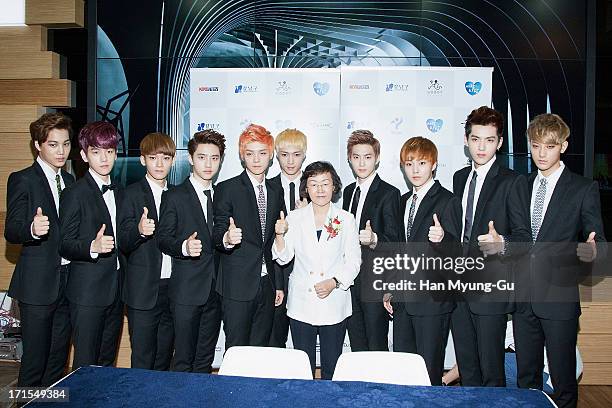 Kai, Baek Hyun, Chen, D.O., Lu Han, Lay, Su Ho, Xiumin, Kris, Tao of boy band EXO and Mayor of Gangnam-Gu, Shin Yeon-Hee attend during the Gangnam...