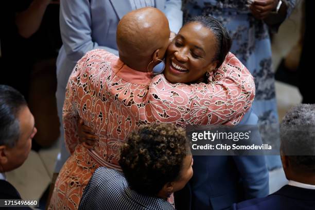 Sen. Laphonza Butler is embraced by Rep. Ayanna Pressley after Butler was sworn in as a member of the Congressional Black Caucus in Statuary Hall at...
