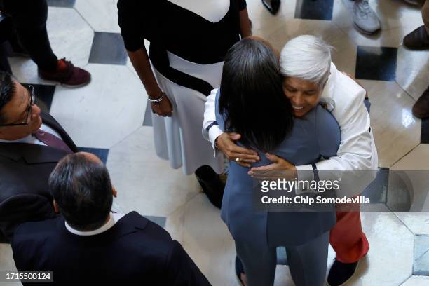 Sen. Laphonza Butler is embraced by Rep. Bonnie Watson Coleman after Butler was sworn in as a member of the Congressional Black Caucus in Statuary...