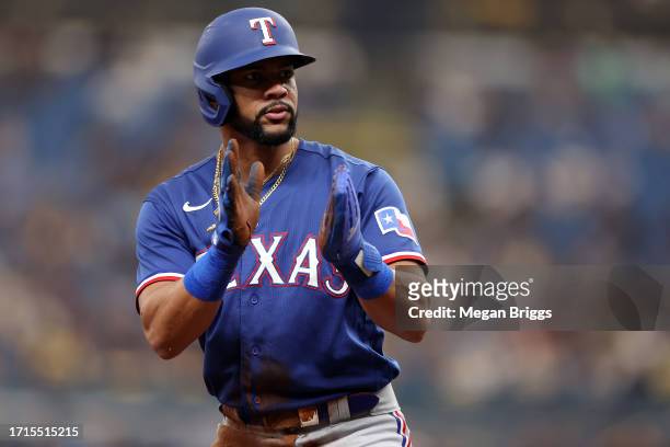 Leody Taveras of the Texas Rangers reacts after stealing second base and reaching third base on a throwing error by the Tampa Bay Rays in the second...