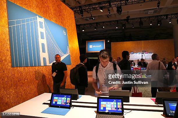 Attendees look at products during the Microsoft Build Conference on June 26, 2013 in San Francisco, California. Microsoft debuted an upgrade to their...