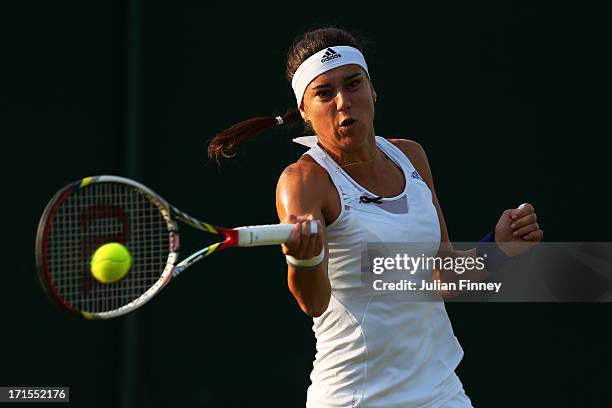 Sorana Cirstea of Romania plays a forehand during her Ladies' Singles second round match against Camila Giorgi of Italy on day three of the Wimbledon...