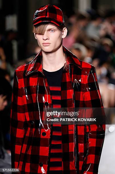 Model presents a creation by Arashi Yanagawa for John Lawrence Sullivan fashion house during the men's spring/summer 2014 ready-to-wear fashion show...