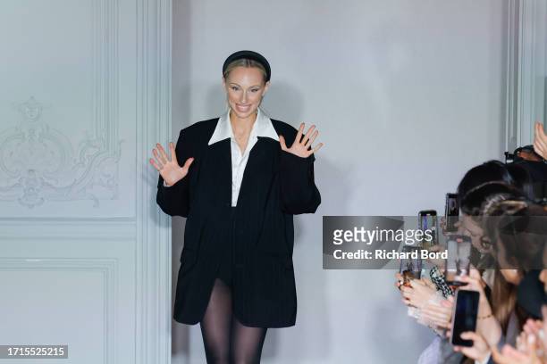Designer Ariane Theunissen acknowledges the audience during the Theunissen Womenswear Spring/Summer 2024 show as part of Paris Fashion Week on...