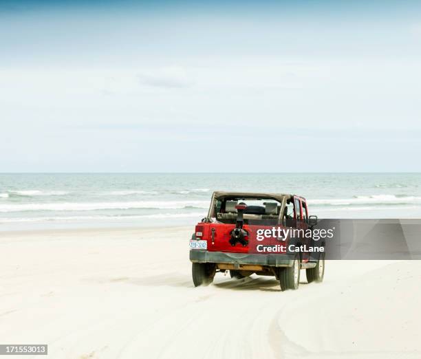 driving across carova beach in north carolina - outer banks stockfoto's en -beelden