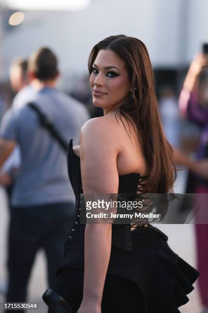 Ashley Graham is seen outside Mugler show wearing blakc corset and black ruffled skirt during the Womenswear Spring/Summer 2024 as part of Paris...