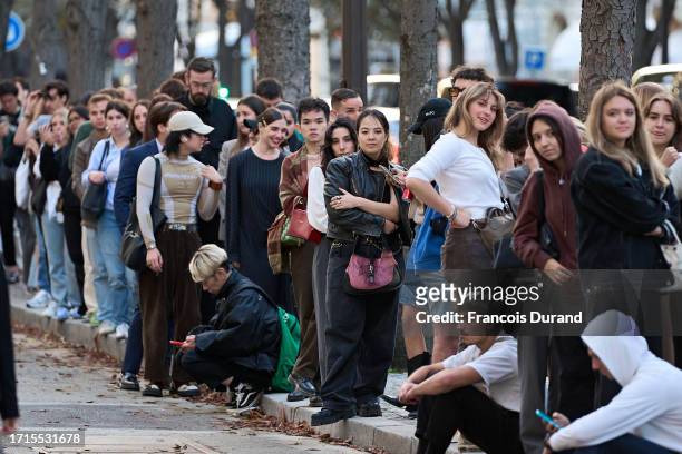 Fans are seen outside the Jacquemus Montaigne store during the "Jacquemus X Martin Parr" book signing as part of Paris Fashion Week at Jacquemus...