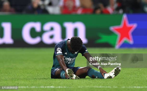 Bukayo Saka of Arsenal reacts before being substituted during the UEFA Champions League match between RC Lens and Arsenal FC at Stade...