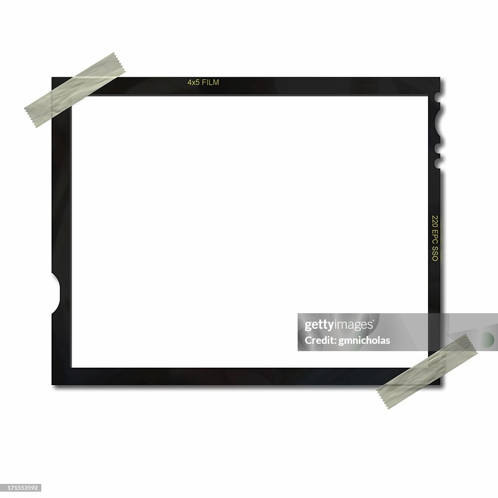 Empty film frame taped on upper left and lower right corners