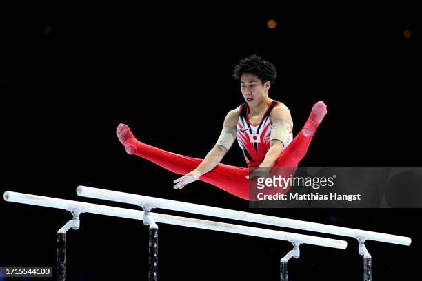 Kaito Sugimoto of Team Japan competes on the Parallel Bars during the Men's Team Final on Day Four of the 2023 Artistic Gymnastics World...