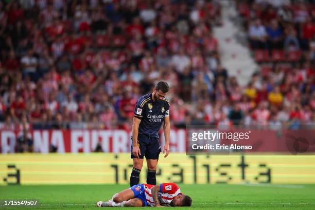 Nacho Fernandez of Real Madrid after the fault with Portu of Girona FC during the LaLiga EA Sports match between Girona FC and Real Madrid CF at...