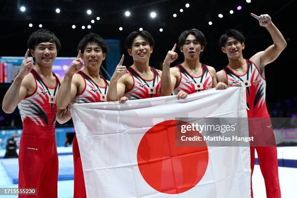 Members of Team Japan celebrate during the Men's Team Final on Day Four of the 2023 Artistic Gymnastics World Championships on October 03, 2023 in...