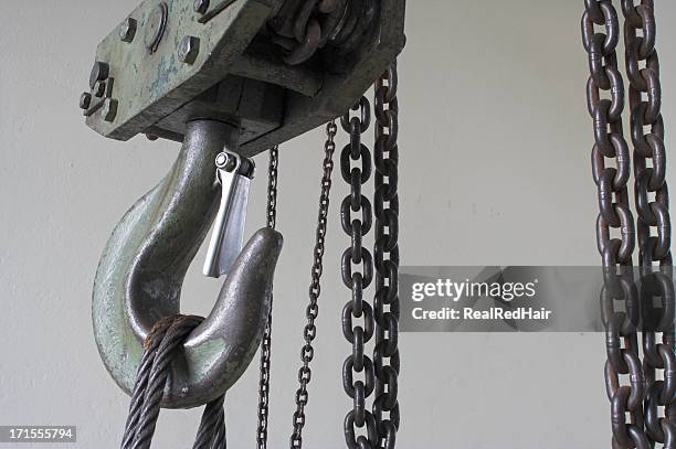 a large hook with rope and chain attached to it - hoisting stock pictures, royalty-free photos & images