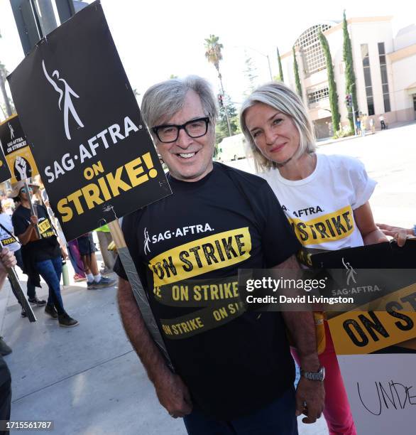 Robert Carradine and Ever Carradine join the picket line outside Warner Bros. Studios on October 03, 2023 in Burbank, California. The WGA has reached...