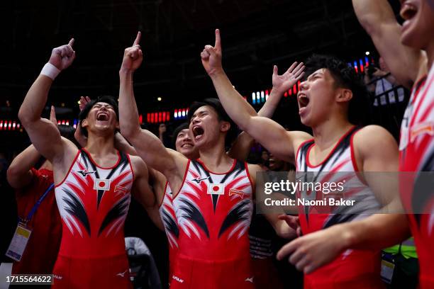 Members of Team Japan celebrate during the Men's Team Final on Day Four of the 2023 Artistic Gymnastics World Championships on October 03, 2023 in...