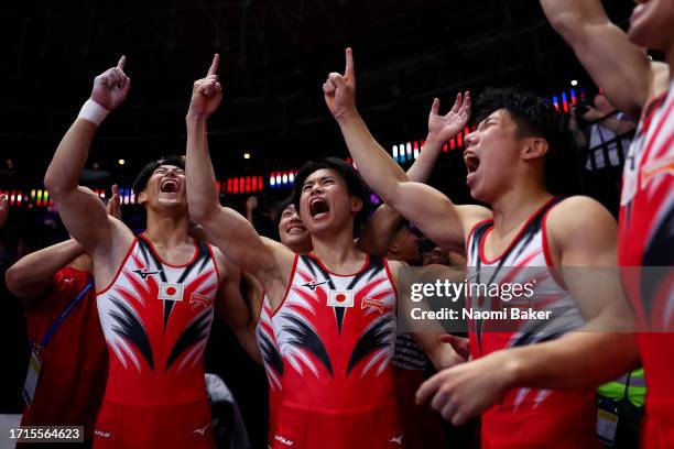 Members of Team Japan celebrate during the Men's Team Final on Day Four of the 2023 Artistic Gymnastics World Championships on October 03, 2023 in...