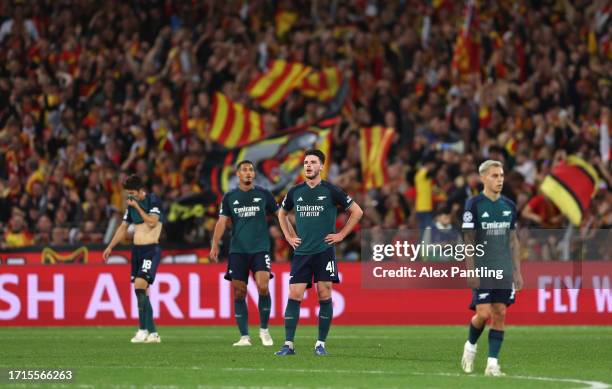 Declan Rice and Arsenal team mates react at Lens score their second goal during the UEFA Champions League match between RC Lens and Arsenal FC at...