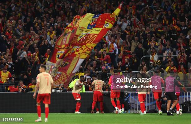 Elyi Wahi of Lens celebrates his sides second goal during the UEFA Champions League match between RC Lens and Arsenal FC at Stade Bollaert-Delelis on...