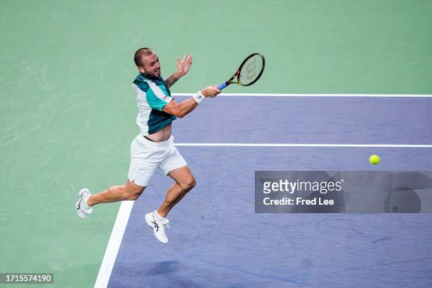 Daniel Evans of Great Britain returns a shot against Carlos Alcaraz of Spain in the Men's Singles Round of 32 match on Day 8 of the 2023 Shanghai...