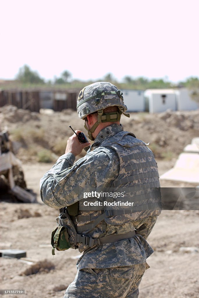 Soldier using radio to communicate