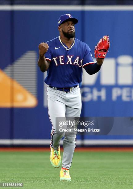 Adolis Garcia of the Texas Rangers reacts after catching the ball for an out in the fifth inning against the Tampa Bay Rays during Game One of the...