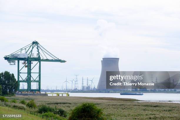 Barge sails on the Scheldt river in front of the Doel nuclear power station on September 26 in the Port of Antwerp, Belgium. The Doel nuclear power...
