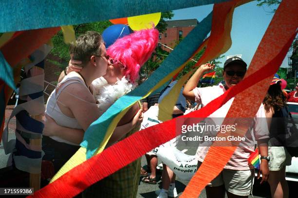 Thousands of people turned out for the fun and sunshine at the Gay Pride Parade. Beth Hastie, right, and Sage Skog kiss, just before the parade kick...