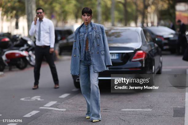 Kelly Piquet is seen outside Zimmermann show wearing a full denim look with blazer, jacket and pants and yellow snake print heels during the...