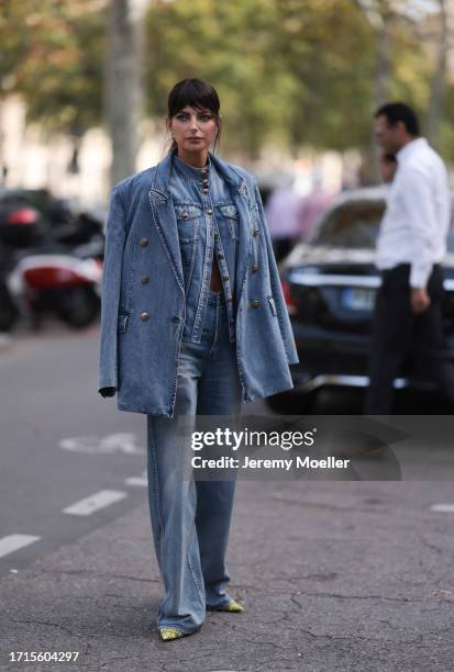 Kelly Piquet is seen outside Zimmermann show wearing a full denim look with blazer, jacket and pants and yellow snake print heels during the...