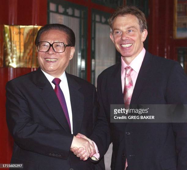 British Prime Minister Tony Blair is greeted by China's Central Military Commission Chairman, and former state President Jiang Zemin, at the...