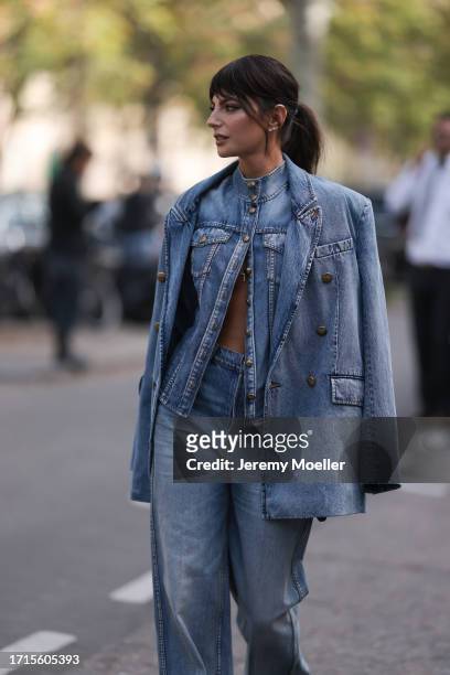 Kelly Piquet is seen outside Zimmermann show wearing a full denim look with blazer, jacket and pants and yellow snake print heels during the...