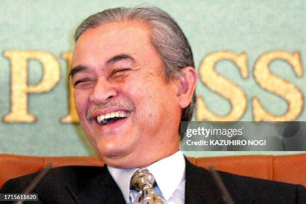 Visiting Malaysian Deputy Prime Minister Abdullah Ahmad Badawi smiles as he attends a news conference at the Japan National Press Club in Tokyo, 11...