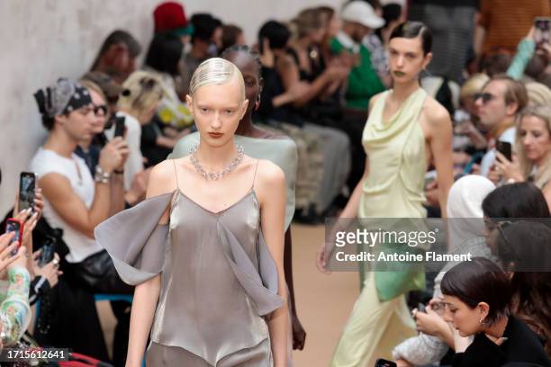 Models walk the runway during the Kiko Kostadinov Womenswear Spring/Summer 2024 show as part of Paris Fashion Week on October 03, 2023 in Paris,...
