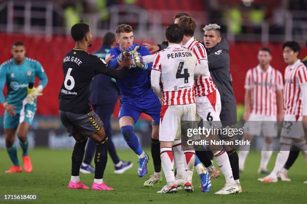 Carlos Alcaraz of Southampton pushes Mark Travers of Stoke City to ground following the Sky Bet Championship match between Stoke City and Southampton...