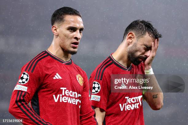 Antony and Bruno Fernandes of Manchester United look dejected following the team's defeat during the UEFA Champions League match between Manchester...