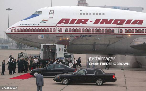 Limousines pull up as an Air India jet carrying visiting Indian Prime Minister Atal Vajpayee arrives, 22 June 2003 in Beijing. Vajpayee is visiting...